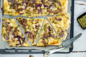 Vegetarische Flammkuchen op oven bakplaat met bakpapier - Elsa Silva, Pexels Vegetarische Flammkuchen op oven bakplaat met bakpapier - Elsa Silva, Pexels